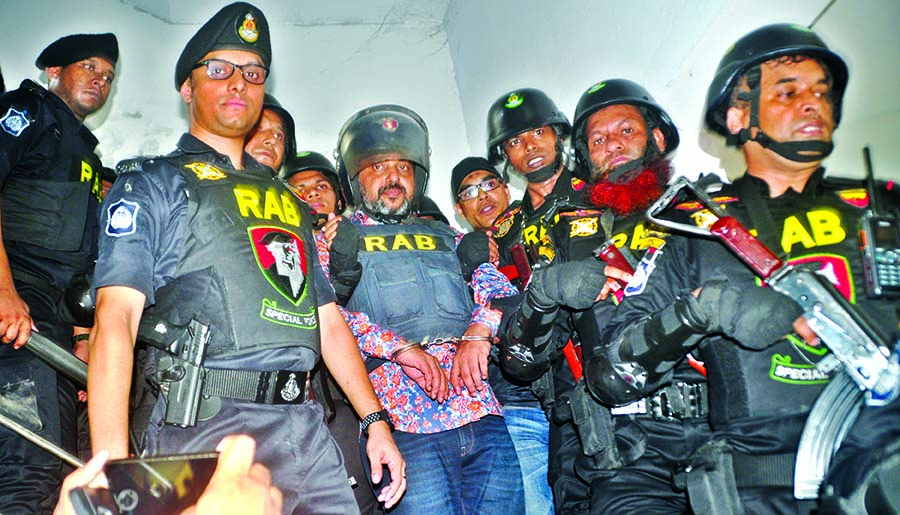 Dhaka South unit of Jubo Leagueâ€™s ex-president Ismail Chowdhury Samrat is being taken to Keraniganj Jail with RAB escort after a raid at his office at Kakrail of Dhaka on Sunday.