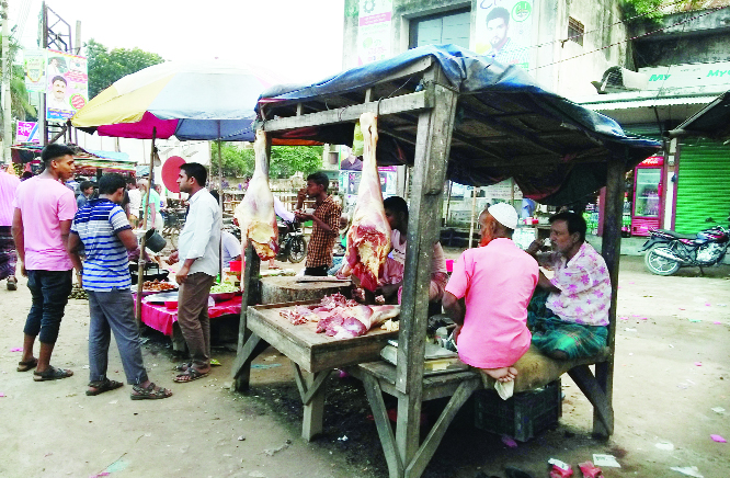 SREEBARDI(Sherpur): Illegal meat markers being built up in front of Sreebardi Central Shaheed Minar. This snap was taken yesterday.