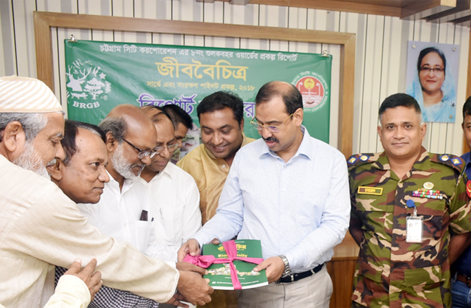 Biodiversity Survey and Conservation report being handed over to CCC Mayor AJM Nasir Uddin at the Auditorium of City Corporation on Sunday.