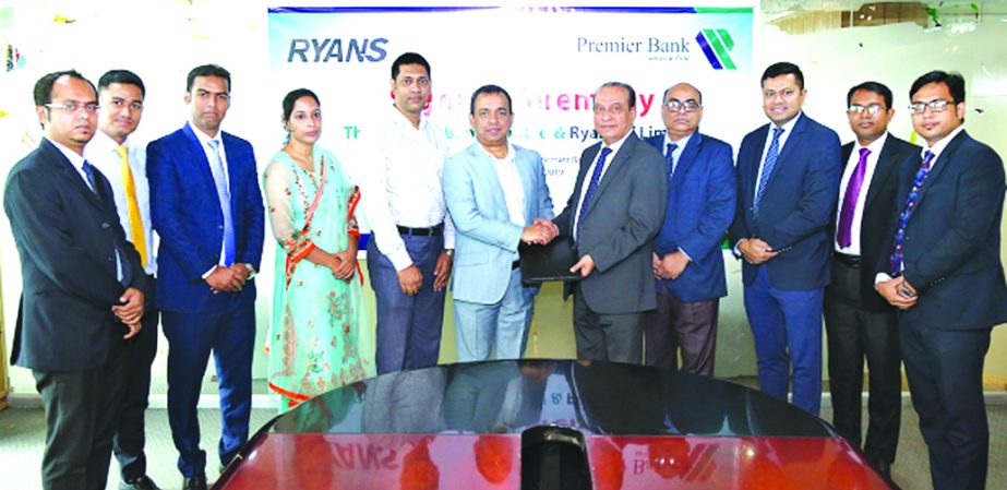 Md Abdul Jabber Chowdhury, Additional Managing Director of Premier Bank Limited and Ahmed Hasan, Managing Director of Ryans IT Ltd, exchanging an agreement signing document at the bank's head office recently. Under the deal, all Premier Bank credit cardh