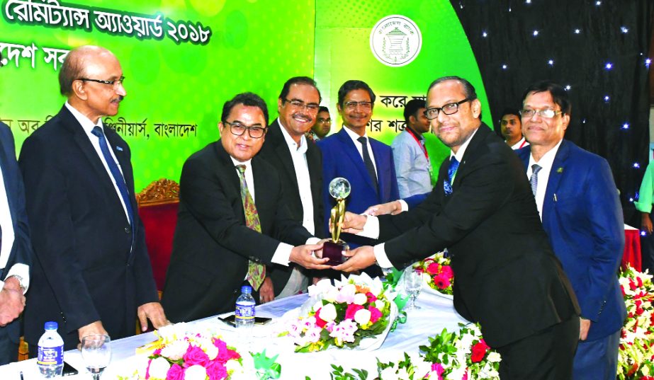 Md. Mahbub ul Alam, Managing Director of Islami Bank Bangladesh Limited, receiving the Best Remittance Collecting Bank for the year-2018 Award from Finance Minister AHM Mustafa Kamal, at Institution of Diploma Engineers Bangladesh auditorium in the city o