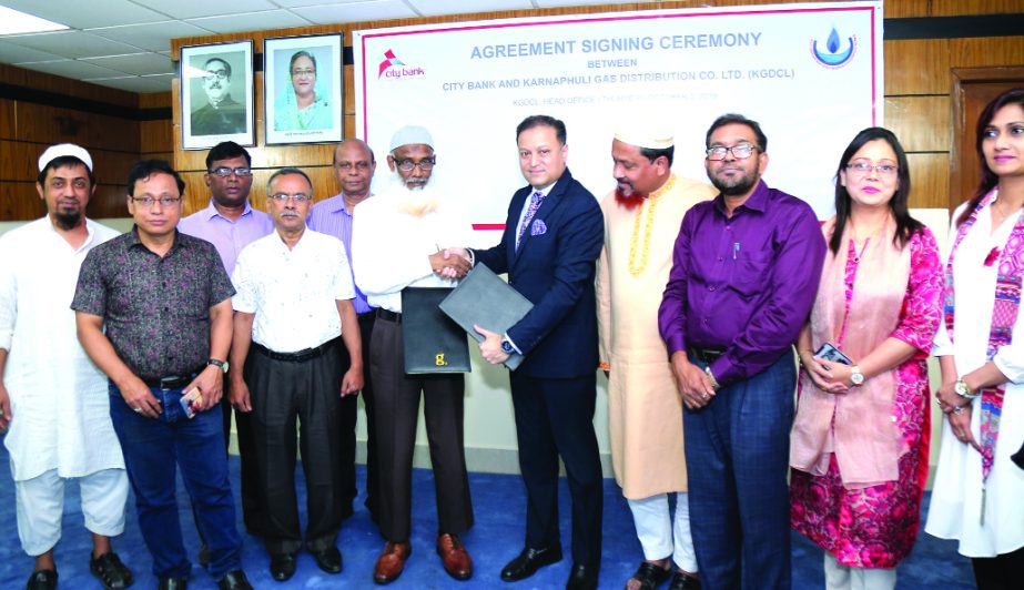 Tahsin Haq, Head of Cash Management of Corporate Banking Division of City Bank and Khaiz Ahmed Mozumder, Managing Director of Karnaphuli Gas Distribution Company Ltd (KGDCL), exchanging documents after signing agreement at the bank's head office recently