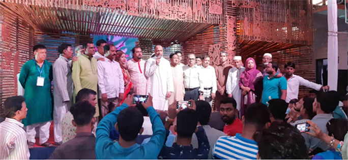 M A Latif MP speaking at a gathering after visiting Udyaon Sangho Puja Mandop at Sight Hindupara recently.