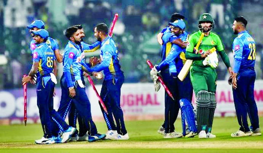 Sri Lankan players celebrate their T20I series win over Pakistan at Lahore on Monday.