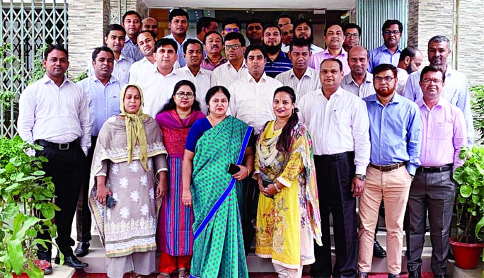 Participants pose for a photo session at a training programme of Assistant Engineers of Roads and Highways Department (RHD) organised recently at the training center of RHD in the city.