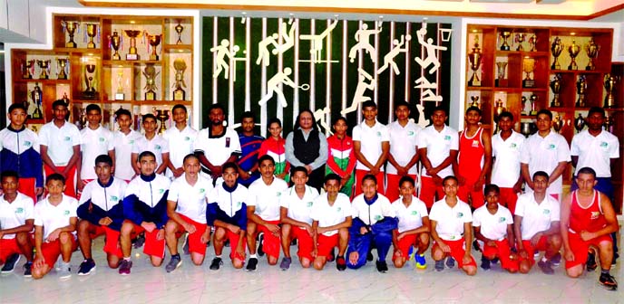 The students of Bangladesh Krira Sikkha Protisthan (BKSP) with Grandmaster Dr Mak Yuree Vajramunee pose for a photo session at BKSP in Savar on Thursday. Bangladesh Butthan Federation conducted a seminar and question & answer session at the same venue on