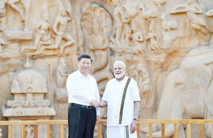 Indian Prime Minister Narendra Modi Â® shakes hands with Chinese President Xi Jinping ahead of their informal summit, but their two countries have never been the best of friends.