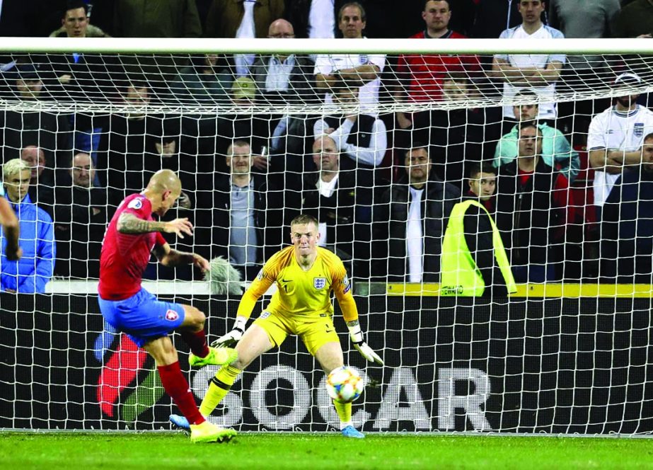 Czech Republic's Zdenek Ondrasek (left) scores his side's second goal during the Euro 2020 group A qualifying soccer match between Czech Republic and England at the Sinobo stadium in Prague, Czech Republic on Friday.