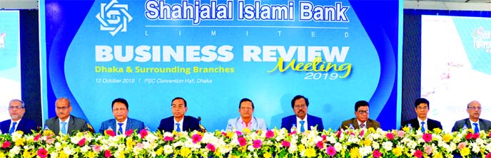 M Shahidul Islam, Managing Director of Shahjalal Islami Bank Limited (SJIBL), presiding over the bank's Business Review Meeting at PSC Convention Hall at Mirpur-14 in Dhaka on Saturday. Bank's Chairman Akkas Uddin Mollah, Director Mohammed Younus and In