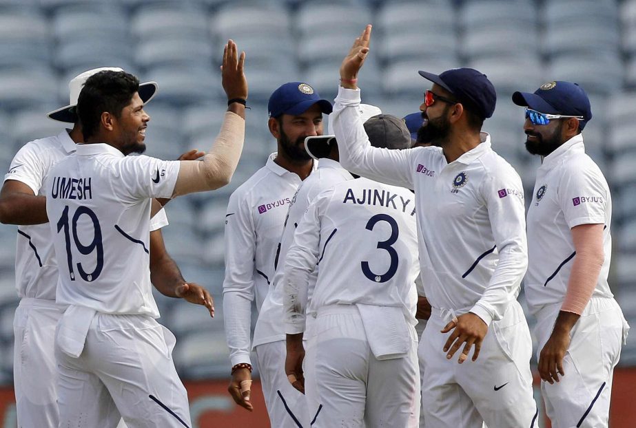 India's cricket team captain Virat Kohli (2nd from right) and Umesh Yadav celebrate the wicket of South Africa's Theunis de Bruyn during the fourth day of second cricket Test match between India and South Africa in Pune, India on Sunday.