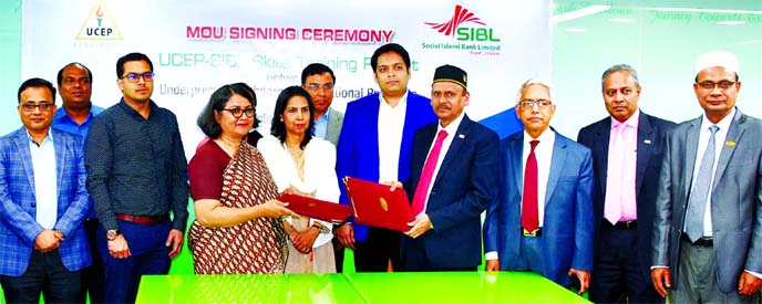 Quazi Osman Ali, CEO of Social Islami Bank Limited and Tahsinah Ahmed, Executive Director of UCEP Bangladesh, exchanging documents after signing a MoU on "UCEP-SIBL Skills Training Project" for providing skill development training to the underprivileged