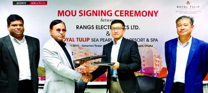 J Ekram Hussain, Managing Director of Rangs Electronics Limited and Brigadier General (Rtd) A H M Mokbul Hossain, CEO of Royal Tulip Sea Pearl Beach Resort & Spa, exchanging documents after signing a MOU at Sonartori Tower in the city on Sunday. Alex Yee,