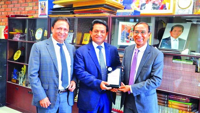 M. Shahidul Islam, Managing Director of Shahjalal Islami Bank Limited, handing over a crest to A K Azad, Managing Director of Ha-Meem Group for achieving the National Export Trophy year of 2016-2017 for their outstanding contribution in country's export