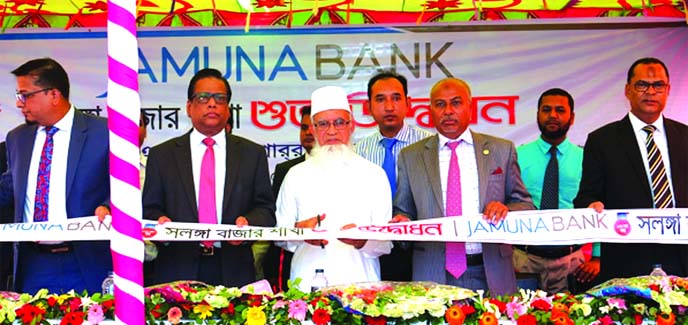 Eng. A.K.M. Mosharraf Hussain, Director, Jamuna Bank Limited, inaugurating its 133rd branch at Solonga Bazar, Raigonj in Sirajgonj recently. Shafiqul Alam, CEO, Nur Mohammad, EC Chairman of the bank and local elites were also present.