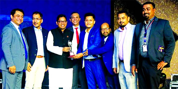 Syed Akthar Hasan Uddin, Director along with Shamim Ahmed, Chief Operating Officer of Guardian Life Insurance Limited (GLIL), receiving the BASIS National ICT Awards-2019 from State Minister for ICT Division Zunaid Ahmed Palak, for securing the 1st Runner