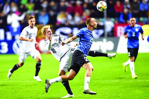 Julian Brandt (left) of Germany competes with Nikita Baranov (right) of Estonia during the UEFA Euro 2020 Qualifier Group C match between Estonia and Germany in Tallinn, Estonia on Sunday.