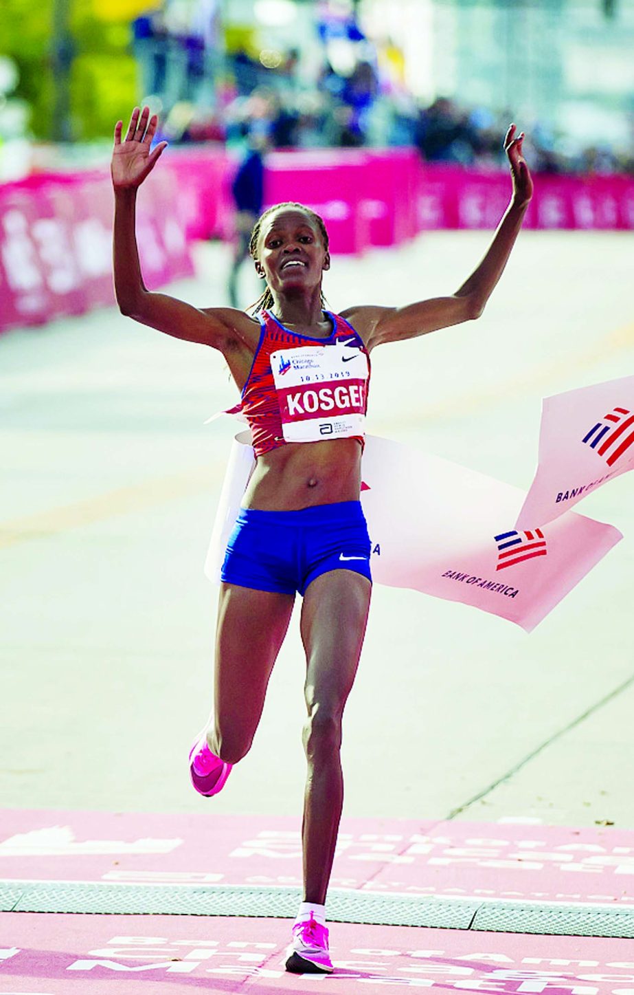 Brigid Kosgei wins the Women's Marathon in World record time in the Chicago Marathon on Sunday.