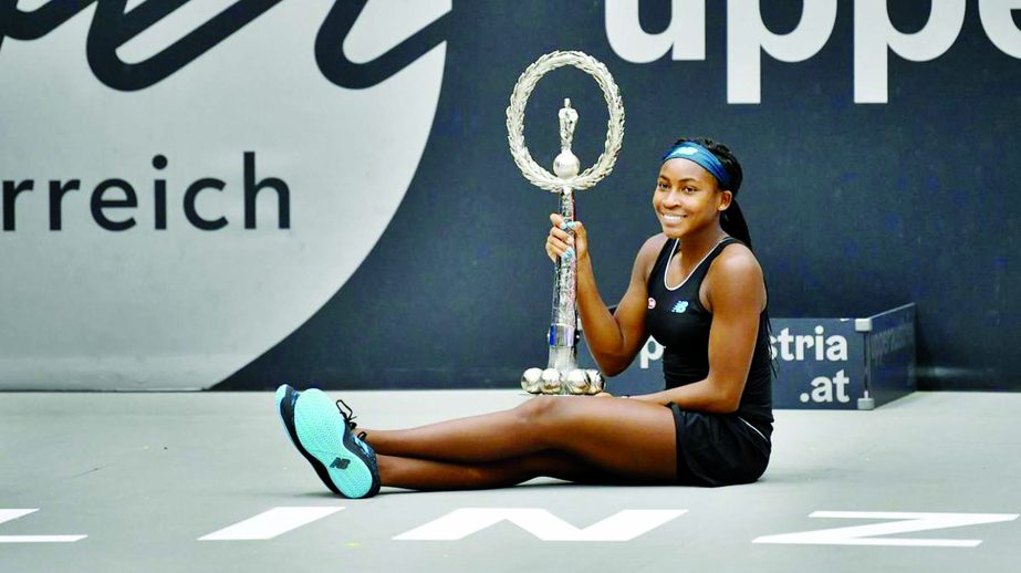 Cori Gauff of US poses with the trophy after she won her WTA-Upper Austria Ladies final tennis match against Jelena Ostapenko of Latvia in Linz, Austria on Sunday.