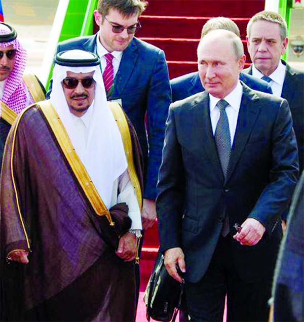 Russian President Vladimir Putin is welcomed by Riyadh Governor Prince Faisal bin Bandar. (SPA) on Monday.