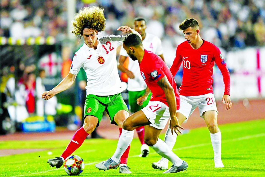 Bulgaria's Bozhidar Kraev (left) fights for the ball with England's Callum Wilson during the Euro 2020 group A qualifying soccer match between Bulgaria and England, at the Vasil Levski national stadium in Sofia, Bulgaria on Monday.
