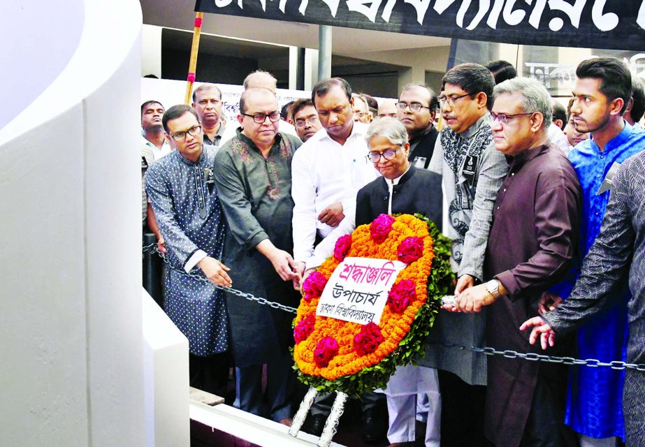 Vice-Chancellor of Dhaka University Prof Dr Akhtaruzzaman placing floral wreaths at Jagannath Hall Memorial Plaque of the university on Tuesday marking Mourning Day of DU.
