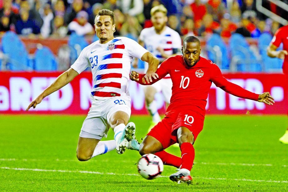 U.S. defender Aaron Long (23) and Canada forward Junior Hoilett (10) vie for the ball during the second half of a CONCACAF Nations League soccer match in Toronto on Tuesday.