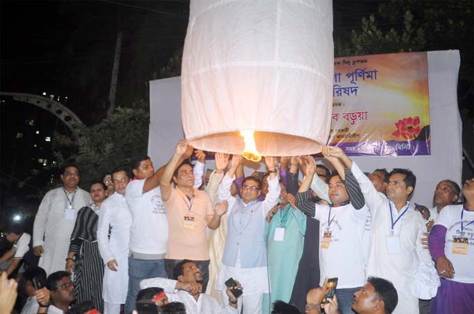 Barrister Biplob Barua, Special Assistant to Prime Minister inaugurating Prabartana Purnima, the second largest festival of the Buddhist Community by releasing candle-lit air balloons at Nandan Kanan Bouddha Bihar in Port City on Monday.