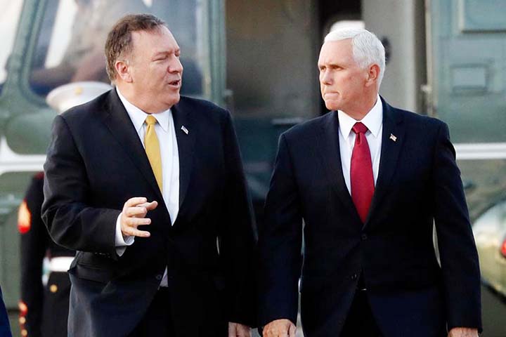 Vice President Mike Pence and Secretary of State Mike Pompeo arrive at Andrews Air Force Base on Wednesday as they depart en route to Turkey.
