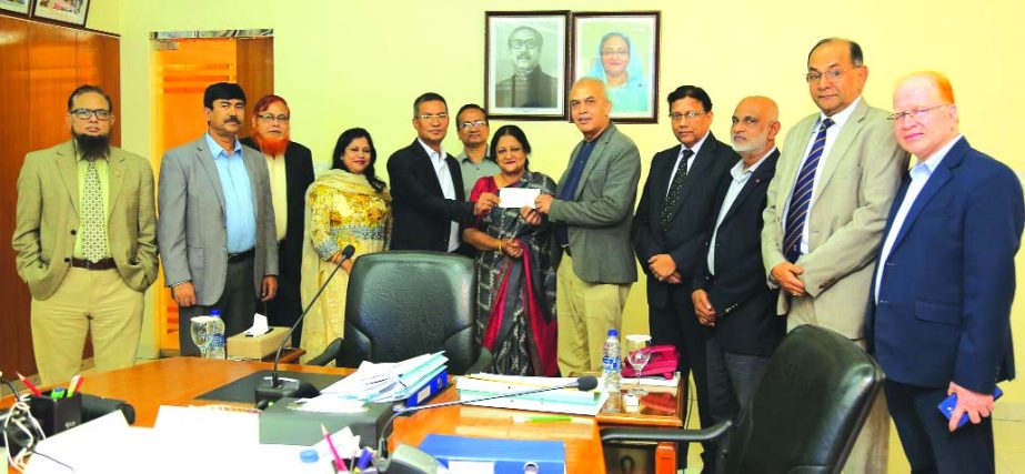 Md. Abdus Salam Azad, CEO of Janata Bank Limited, handing over a cheque of Tk. 2.00 crore as Cash Dividend for the year ended in 2018 on behalf of Janata Capital and Investment Limited (JCIL) to D. Jamal Uddin Ahmed, Chairman of Janata Bank Limited (JBL)