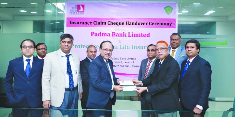 Md. Yousuf Ali Mridha, CEO of Protective Life Insurance Limited, handing over a cheque to Md. Ehsan Khasru, CEO of Padma Bank Limited at its head office in the city on Tuesday. Senior officials from both the sides were also present on the occasion.