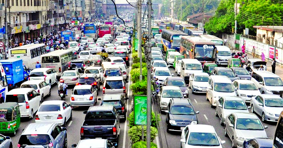Thousands of cars get stranded for hours on key roads in Dhaka city on Thursday, as the capital was blighted by severe traffic jam on the eve of weekend. This snap was taken at 12.30pm from Banani main road.