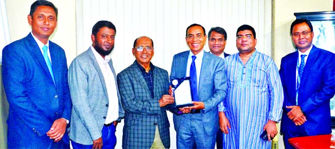 M Shahidul Islam, Managing Director of Shahjalal Islami Bank Ltd, handing over a crest to Engineer Md Towhidur Rahman, Managing Director of Fresh Foods Ltd and Sea Fresh Ltd, for achieving CIP status at the bank's head office recently. Bank's Vice-Chair