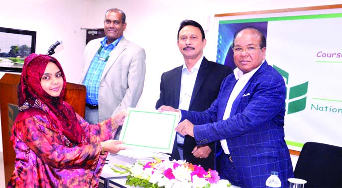 A S M Bulbul, Head of Human Resources Division of National Bank Limited, distributing certificates among the participants of a 12 day-long training programme on "Foreign Exchange Risk Management & Financing in International Trade" at its training instit