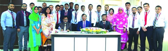 Md Tariqul Azam, Managing Director (acting) of Standard Bank Limited, poses along with participants after attending a two day-long workshop on "Islamic Banking: Concept, Products & Services" for the Bank's branch Officers at the Training Institute of t
