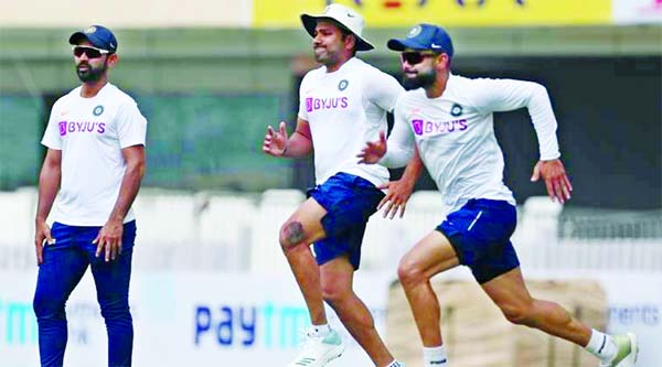Virat Kohli(right)and Rohit Sharma(centre)run past teammate Ajinkya Rahane(left) during a training session ahead of their third Test at Ranchi against South Africa on Friday.