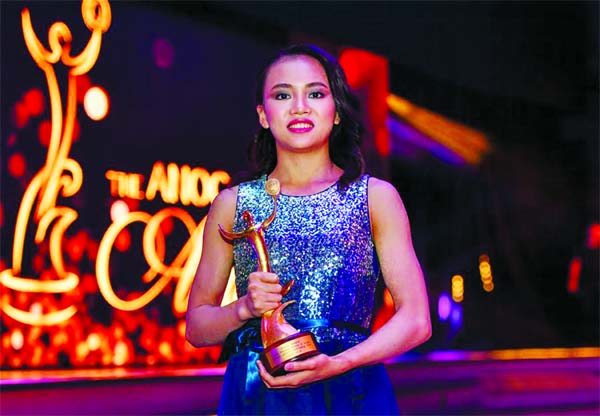 Chinese gymnast Chen Yile poses for photos after getting the ANOC award for Best Female Athlete of Asian Games 2018 during awarding ceremony of the ANOC Awards 2019 at the XXIV ANOC General Assembly Qatar 2019 in Doha, capital of Qatar on Thursday.