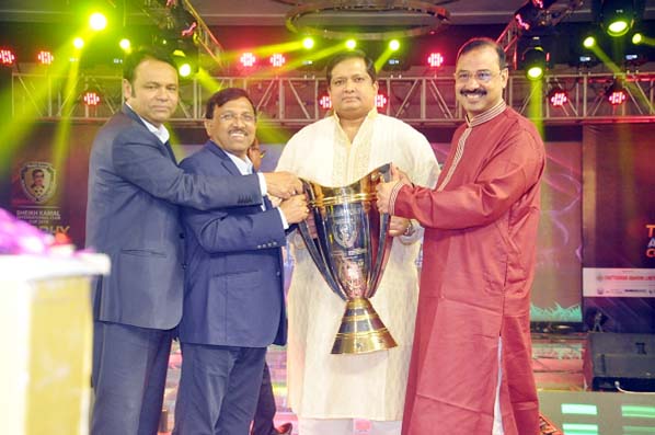 State Minister for Youth and Sports Zahid Ahsan Russel MP handing over the trophy to CCC Mayor AJM Nasir Uddin on Thursday night.