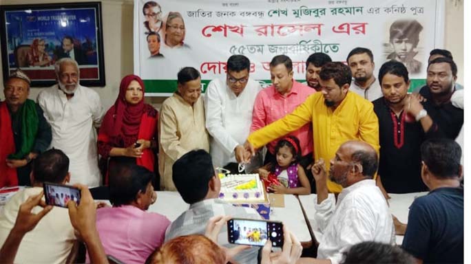 M A Latif MP cutting cake at the Port City marking the birthday of Sheikh Russel on Friday.
