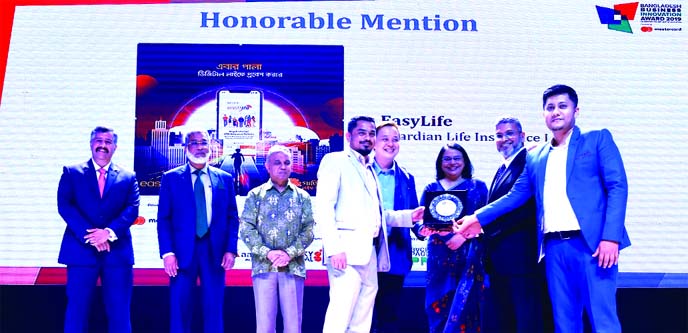 M Monirul Alam, Managing Director of Guardian Life Insurance Limited, receiving Bangladesh Business Innovation Award-2019 from Barrister Nihad Kabir, President of Metropolitan Chamber of Commerce & Industry (MCCI) at a city hotel recently. Head of IT Abu