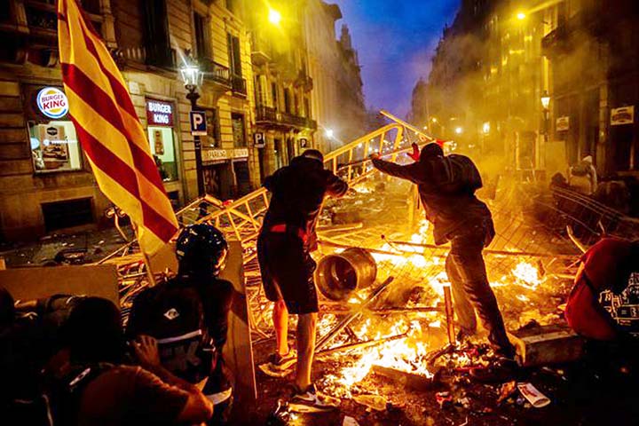 Violent clashes escalated in Barcelona late Friday, as radical Catalan separatists hurled rocks and fireworks at police, who responded with teargas and rubber bullets, turning the city centre into a chaotic battleground.