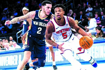 New York Knicks guard Dennis Smith Jr. (5) drives to the basket against New Orleans Pelicans guard Lonzo Ball (2) during the second half of a preseason NBA basketball game at Madison Square Garden in New York on Friday.