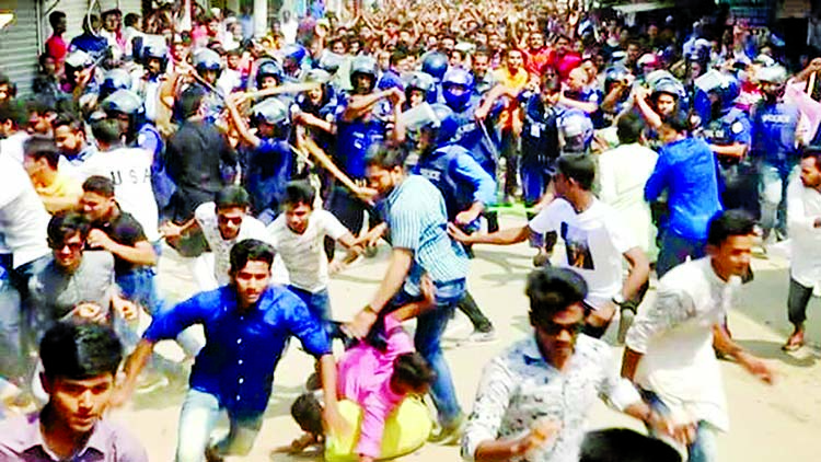 Police charge batons and dispersed two groups of BCL students engaged in clashes in front of Patharghata Awami League office at Barguna leaving 30 people injured following the expulsion of BCL General Secretary Enamul Hossain as intruder. This photo was t