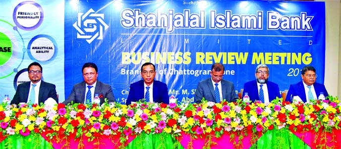 M. Shahidul Islam, CEO of Shahjalal Islami Bank Limited (SJIBL), presiding over its Business Review Meeting with the officials of Chattogram & Cox's Bazar area branches at a local hotel in Chattogram on Saturday. Abdul Aziz, AMD, Khondkar Rafiq-Uz-Zaman,