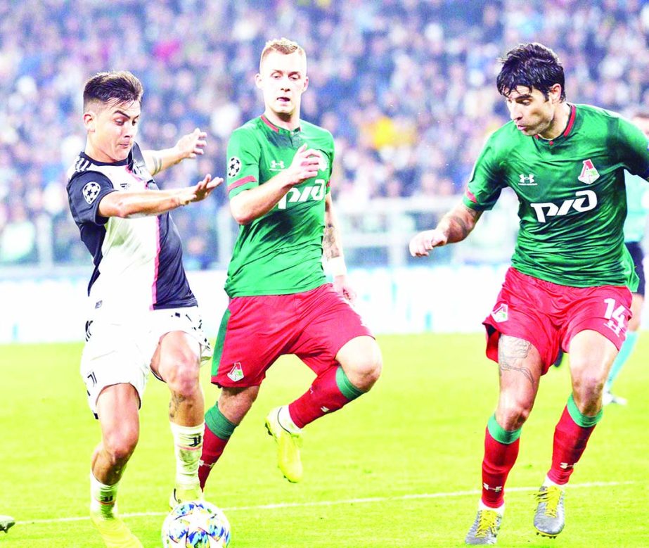 Juventus' Paulo Dybala (left) controls the ball during the UEFA Champions League group D soccer match against Lokomotiv Moscow at the Allianz Stadium in Turin, Italy on Tuesday.