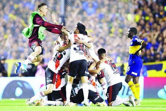 River Plate players celebrate qualifying for the final, at the end of their 0-1 loss to Boca Juniors in a Copa Libertadores semifinal second leg soccer match at La Bombonera stadium in Buenos Aires, Argentina on Tuesday. River won 2-1 on aggregate and qu