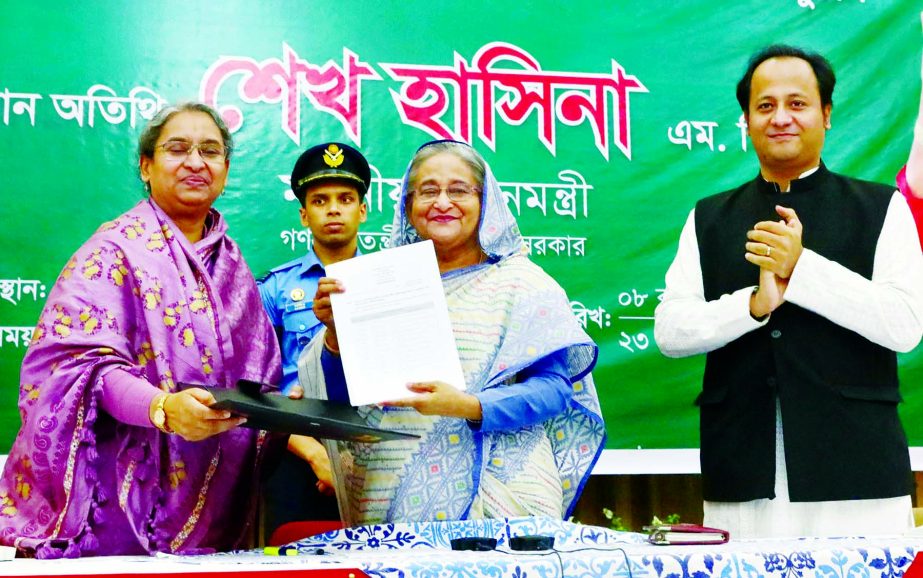 Prime Minister Sheikh Hasina receiving the list of educational institutions brought under the monthly pay order (MPO) scheme from Education Minister Dr Dipu Moni at Ganobhaban in the city on Wednesday. BSS photo