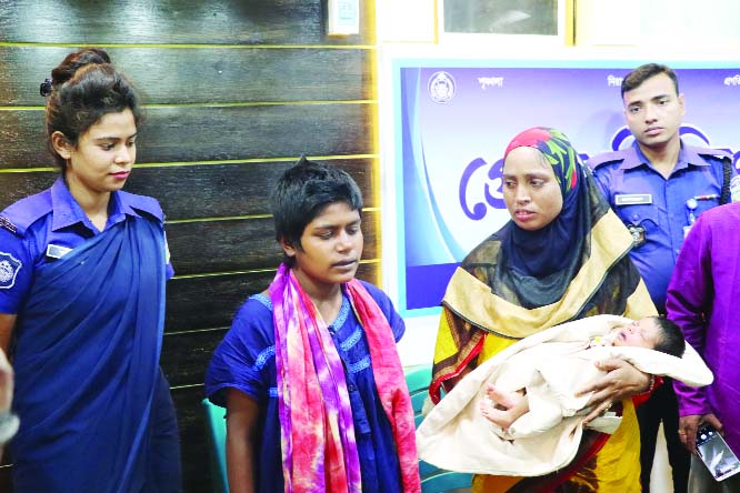 NETRAKONA: An unidentified mentally retarded young woman with her newly born baby undergoing treatment at the female ward of Netrakona Sadar Hospital since October 16 last.