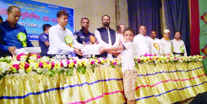 TANGAIL: Md Nurul Islam, DC, Tangail distributing prizes among the winners of art competition in observance of the Community Policing Day jointly organised by Tangail District Police and District Community Policing yesterday.