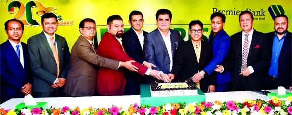 Dr. H.B.M. Iqbal, founder Chairman of Premier Bank Limited along with its Vice Chairman Moin Iqbal, member of the Board of Directors Abdus Salam Murshedy, MP, Mohammad Imran Iqbal and Jamal G Ahmed, inaugurating its 20 years of operations by cutting a cak