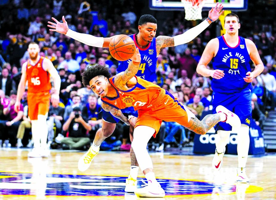 Phoenix Suns' Kelly Oubre Jr. (3) grabs a loose ball in front of Denver Nuggets guard Gary Harris (14) during the fourth quarter of an NBA basketball game in Denver on Friday. Denver won 108-107 in overtime.